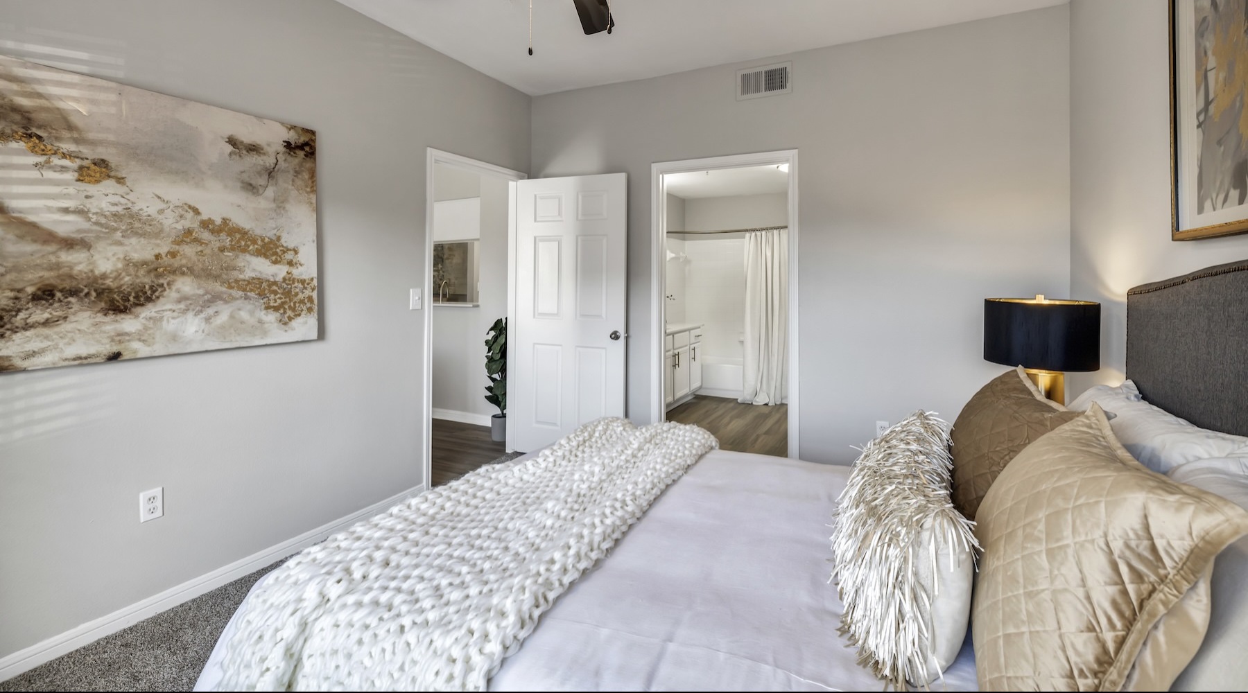 a bedroom with a bed and two doors