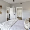 a bedroom with a bed and two doors
