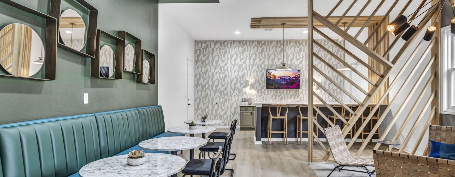 a clubroom with tables and chairs