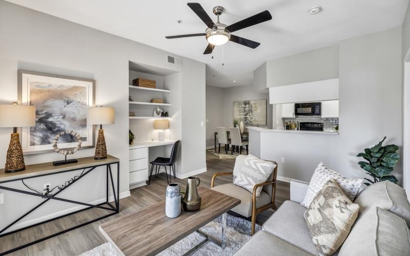 a living room with a couch and a desk area