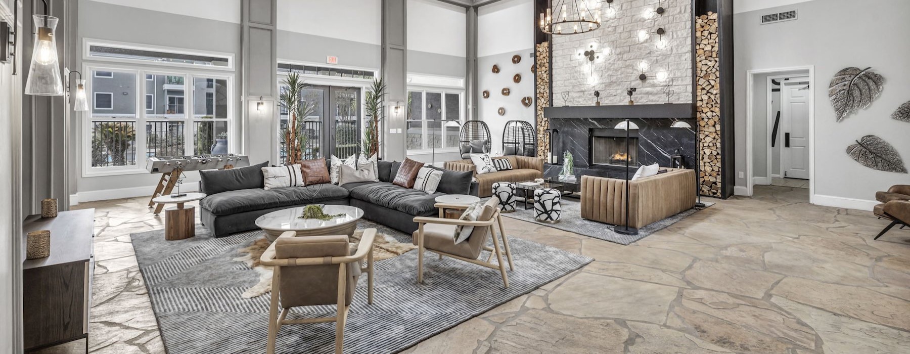 a clubroom with couches, tables and chairs