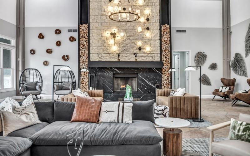 a clubroom with a fireplace and couches