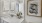 a bathroom with a painting on the wall
